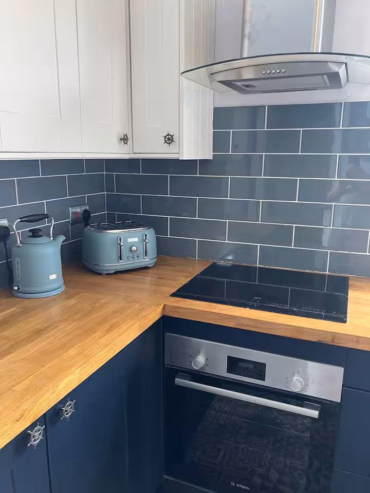 The kitchen worktop with cooker, kettle and toaster