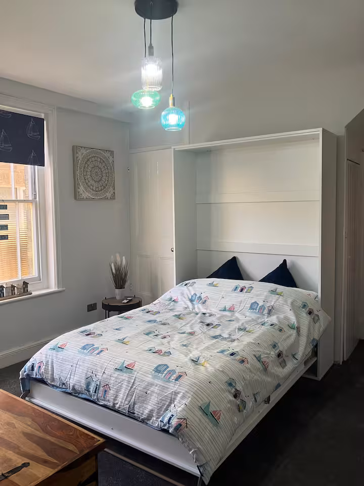 The same room with the double pull-down bed lowered